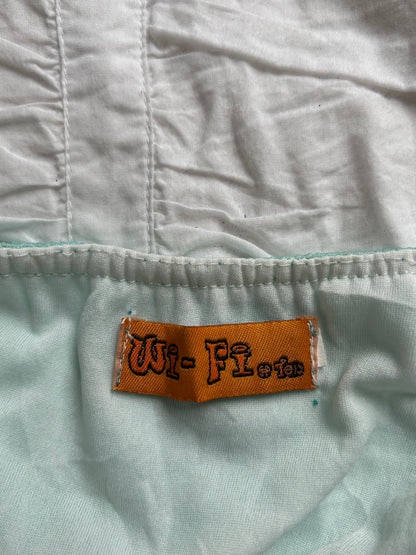 Verspieltes Cocktailkleid Türkis Pailletten-Details & Zipfelsaum